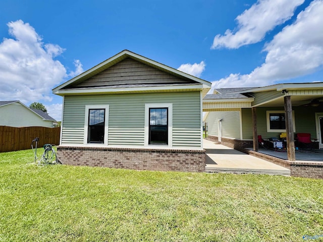 624 2nd Ave S, Loretto, TN 38469 - rear view of house with brick siding and a patio