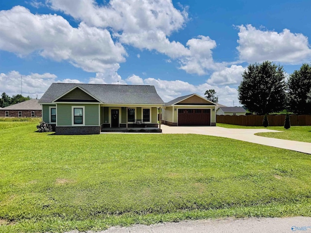 624 2nd Ave S, Loretto, TN 38469 - view of front of home featuring covered porch, concrete driveway, an attached garage, and brick siding