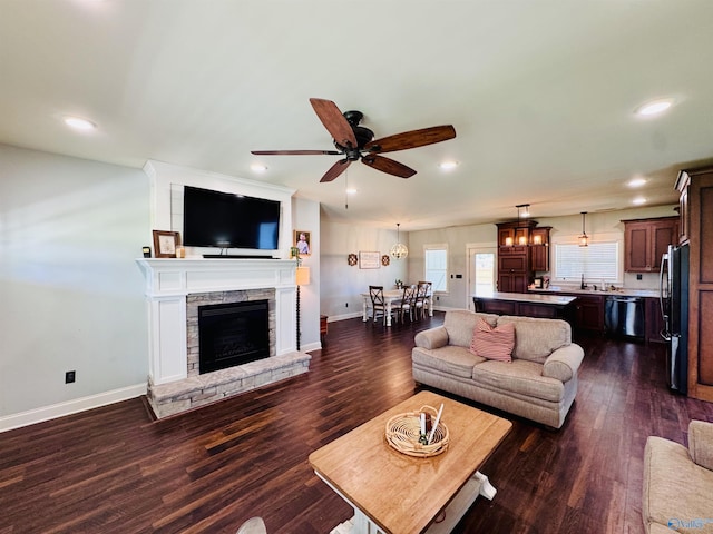 624 2nd Ave S, Loretto, TN 38469 - living area featuring dark wood-style flooring, recessed lighting, ceiling fan, and a fireplace