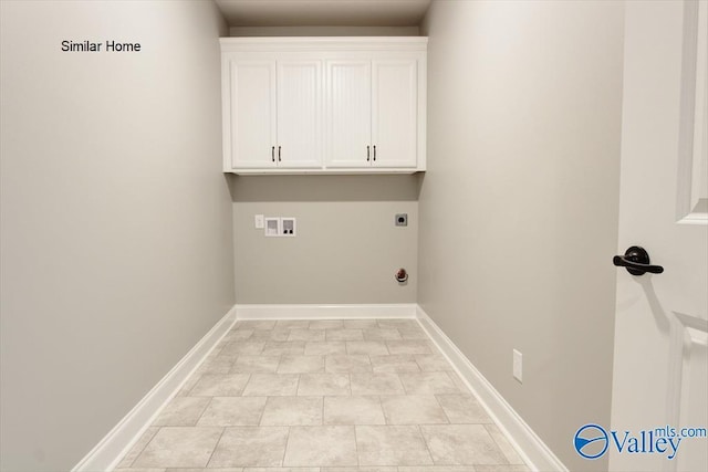 washroom featuring hookup for a washing machine, light tile patterned flooring, cabinets, and hookup for an electric dryer