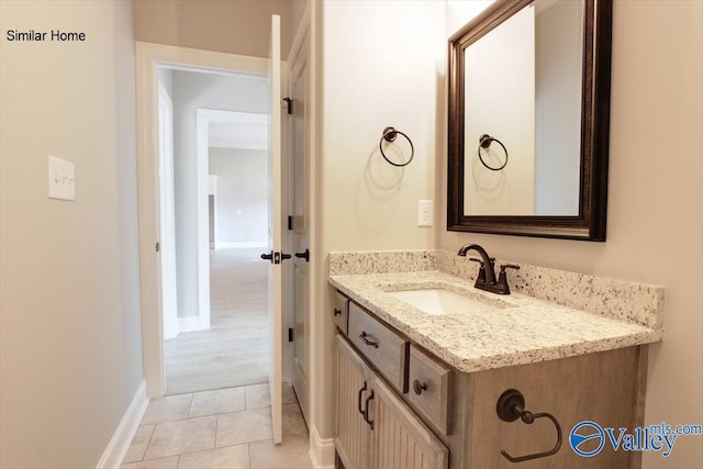 bathroom with tile patterned flooring and vanity