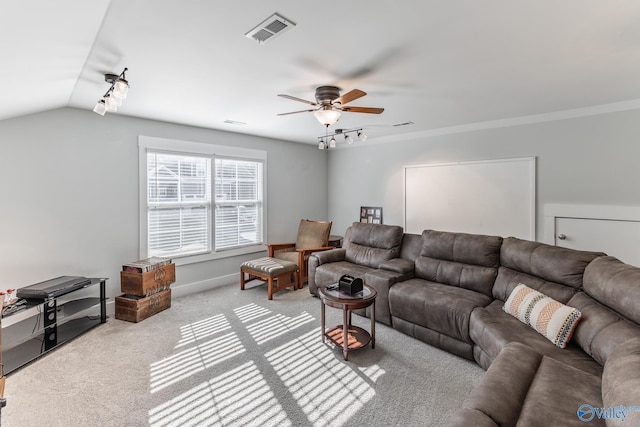 living room with ceiling fan, light colored carpet, rail lighting, and vaulted ceiling