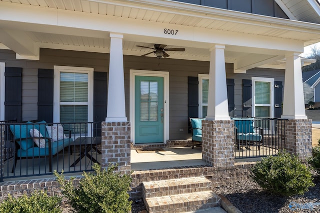 doorway to property with ceiling fan and covered porch