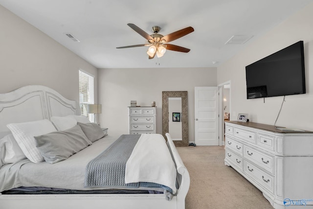 bedroom featuring light carpet and ceiling fan