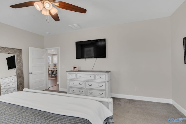 bedroom featuring light colored carpet and ceiling fan