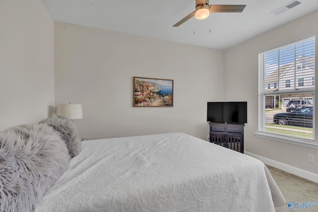 bedroom with ceiling fan and carpet floors