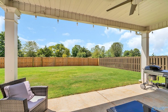 view of yard featuring a patio and ceiling fan