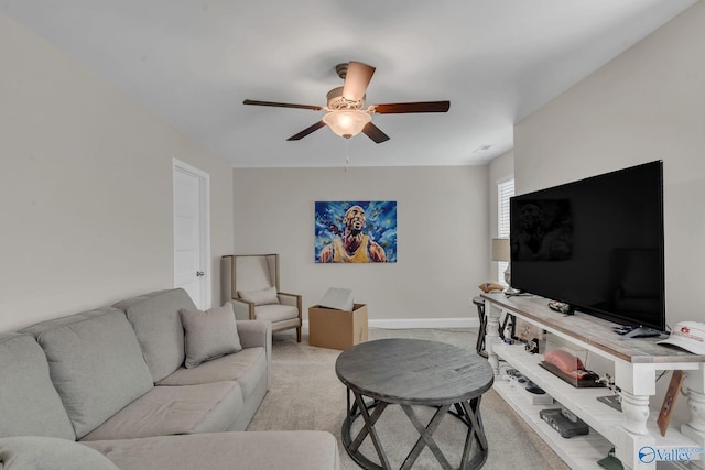 carpeted living room featuring ceiling fan