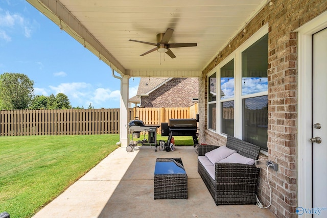 view of patio featuring area for grilling and ceiling fan