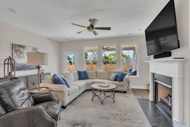 living room with ceiling fan and hardwood / wood-style floors