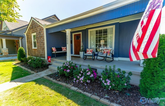 doorway to property with a porch