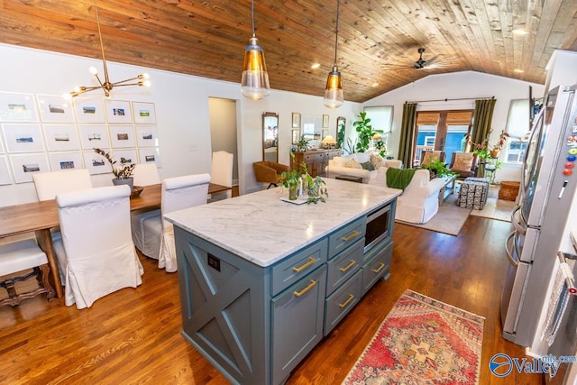 kitchen featuring appliances with stainless steel finishes, dark hardwood / wood-style flooring, vaulted ceiling, decorative light fixtures, and wooden ceiling