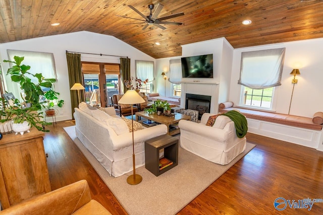 living room featuring ceiling fan, dark hardwood / wood-style flooring, and wood ceiling