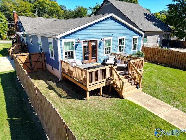 back of house with a lawn, a wooden deck, and an outdoor living space