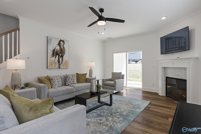 24139 Patriot Dr, Athens, AL 35613 - living room featuring a fireplace, dark wood-type flooring, ornamental molding, and ceiling fan