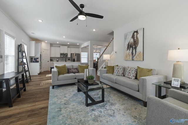 24139 Patriot Dr, Athens, AL 35613 - living room with dark wood-type flooring and ceiling fan with notable chandelier
