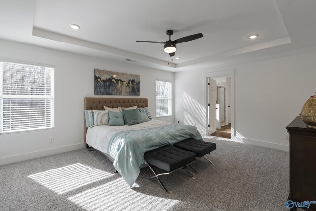 24139 Patriot Dr, Athens, AL 35613 - carpeted bedroom featuring a raised ceiling and ceiling fan
