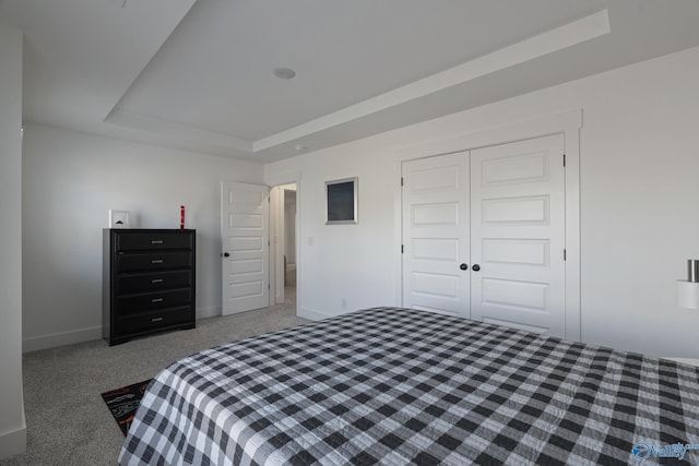 24139 Patriot Dr, Athens, AL 35613 - carpeted bedroom featuring a raised ceiling and a closet