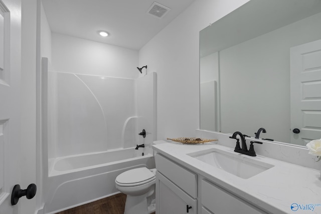 24139 Patriot Dr, Athens, AL 35613 - full bathroom featuring vanity, hardwood / wood-style flooring, shower / tub combination, and toilet