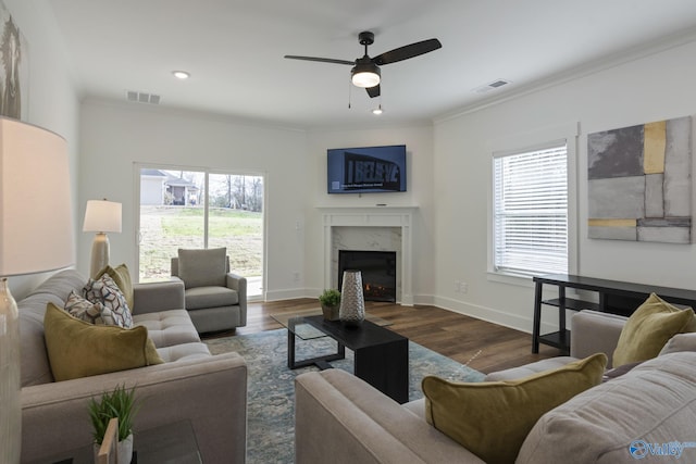 24139 Patriot Dr, Athens, AL 35613 - living room with a fireplace, wood-type flooring, ornamental molding, and ceiling fan