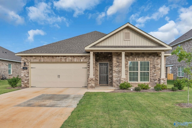 craftsman inspired home featuring a front yard and a garage