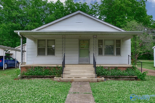 bungalow-style house featuring a front yard and covered porch