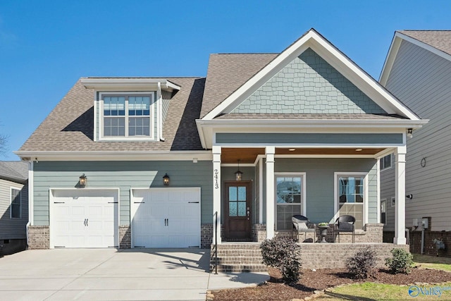 craftsman-style house featuring covered porch and a garage