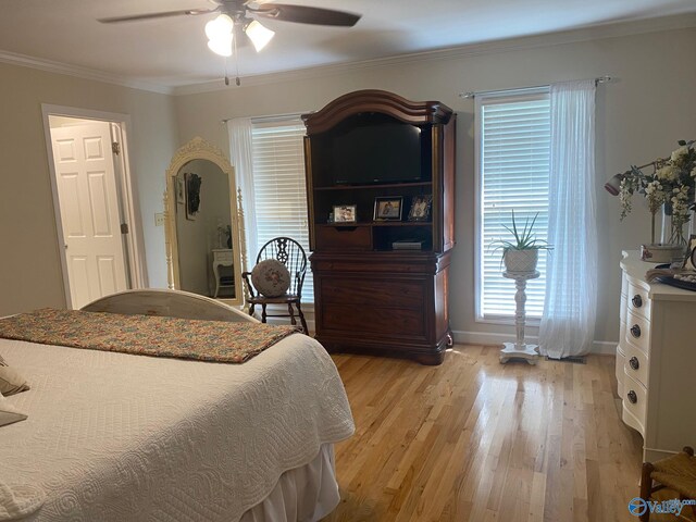 bedroom with ceiling fan, light hardwood / wood-style floors, and ornamental molding