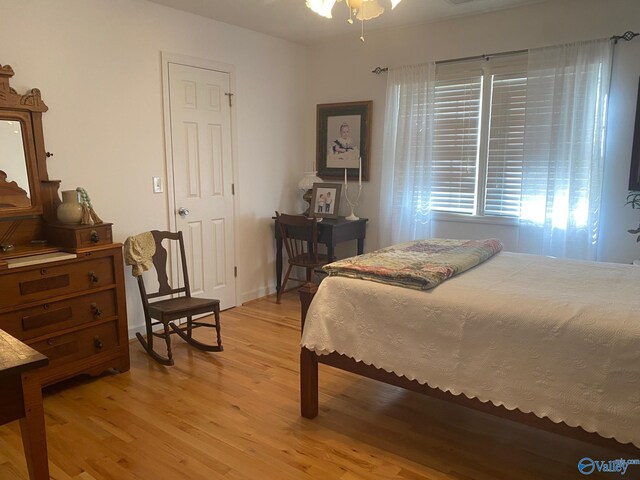 bedroom with light hardwood / wood-style flooring