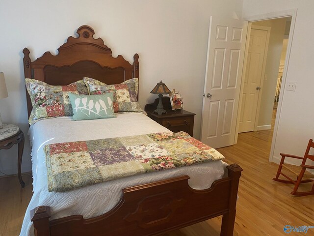 bedroom with light hardwood / wood-style flooring