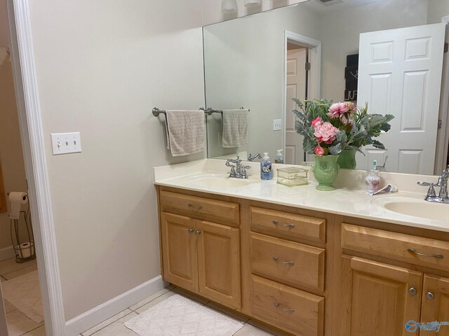 bathroom featuring double vanity and tile patterned floors