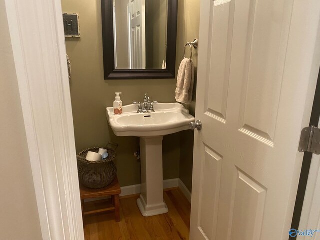 bathroom with wood-type flooring