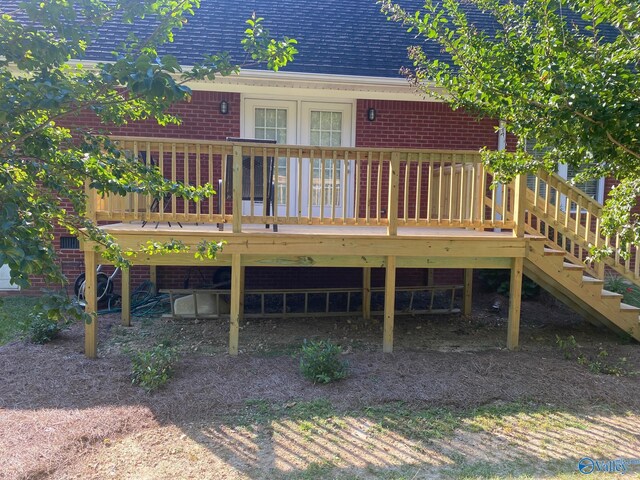 rear view of property featuring a deck