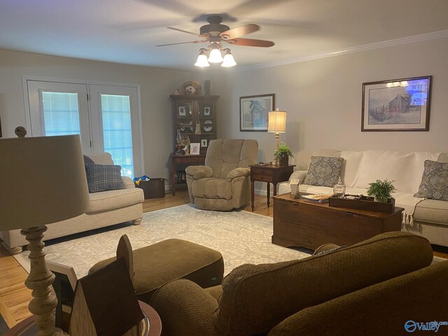 living room with light hardwood / wood-style flooring, ceiling fan, french doors, and crown molding