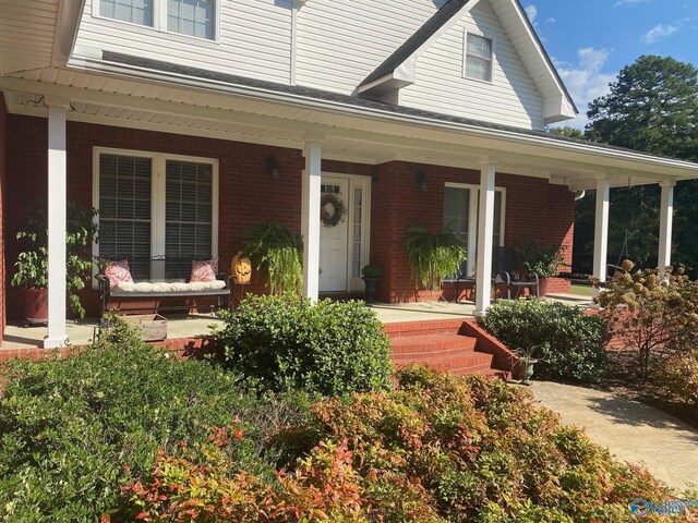 entrance to property with covered porch