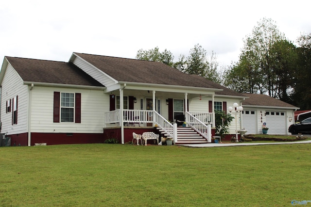 view of front facade featuring a front yard, a garage, and a porch