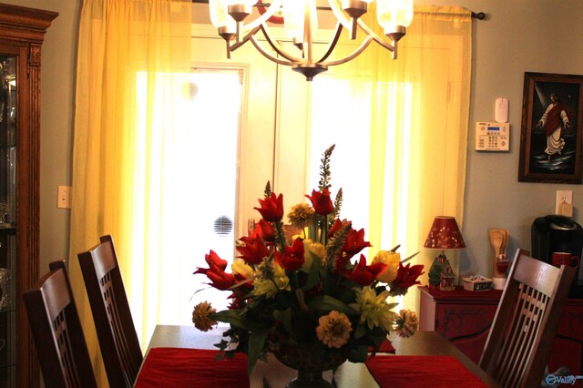 dining space with a notable chandelier and a wealth of natural light