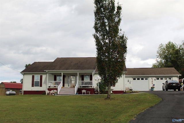 ranch-style house with a garage, a porch, and a front lawn