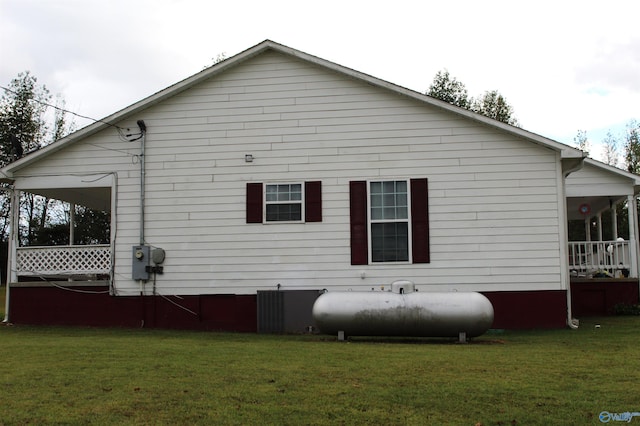 back of property with a lawn