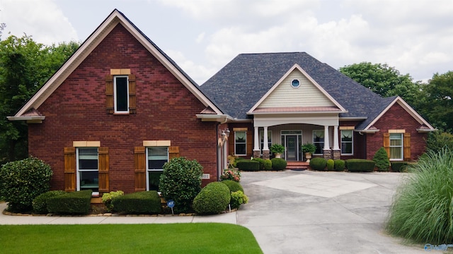 601 Smokey Mountain Cir, Huntsville, AL 35803 - craftsman-style home with covered porch, brick siding, and roof with shingles