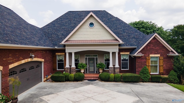 601 Smokey Mountain Cir, Huntsville, AL 35803 - craftsman house with covered porch, driveway, a garage, and brick siding