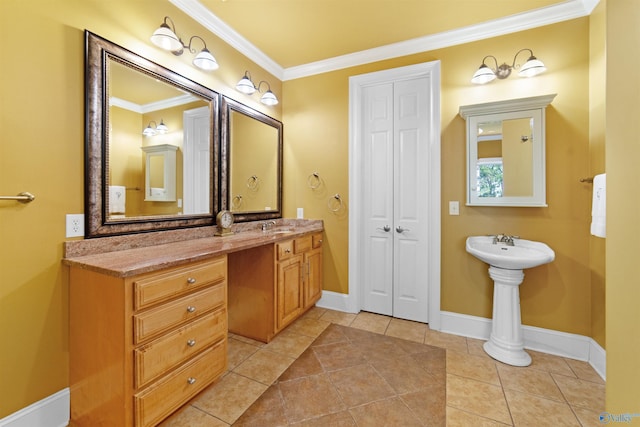 601 Smokey Mountain Cir, Huntsville, AL 35803 - bathroom with ornamental molding, a sink, baseboards, a closet, and tile patterned floors