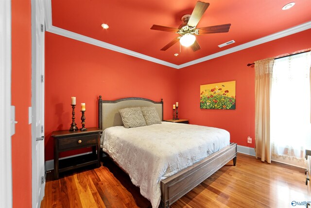 601 Smokey Mountain Cir, Huntsville, AL 35803 - bedroom featuring wood finished floors, multiple windows, baseboards, crown molding, and a ceiling fan