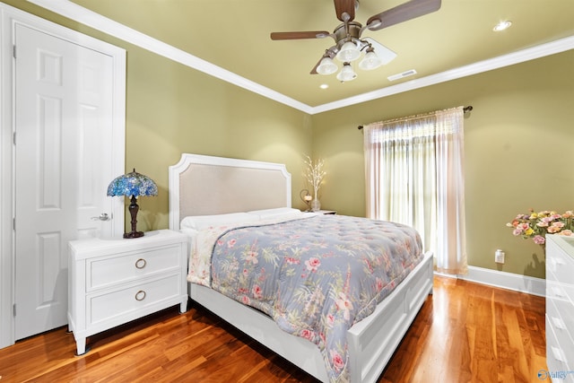 601 Smokey Mountain Cir, Huntsville, AL 35803 - bedroom with wood finished floors, ornamental molding, baseboards, a ceiling fan, and recessed lighting