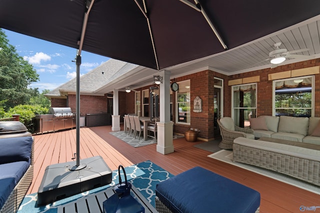 601 Smokey Mountain Cir, Huntsville, AL 35803 - wooden deck with outdoor lounge area, a ceiling fan, and outdoor dining space