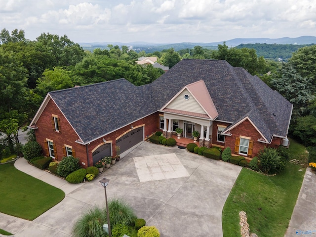 601 Smokey Mountain Cir, Huntsville, AL 35803 - view of front of property with a porch, driveway, an attached garage, and a front yard