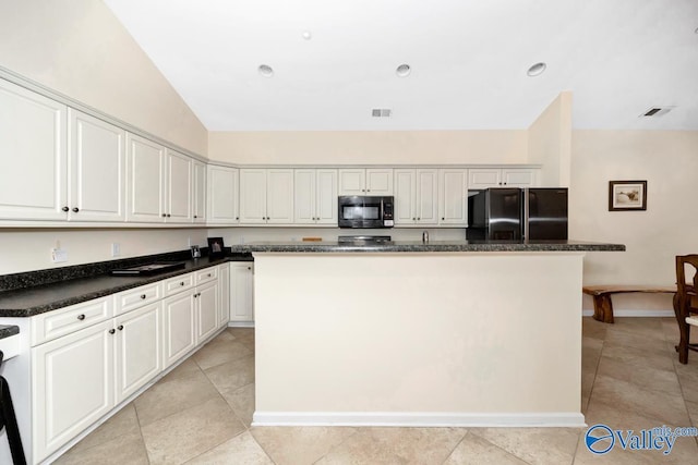 77 Valley Way Cir SE Unit 77, Huntsville, AL 35802 - kitchen featuring black appliances, a center island, dark countertops, and light tile patterned floors