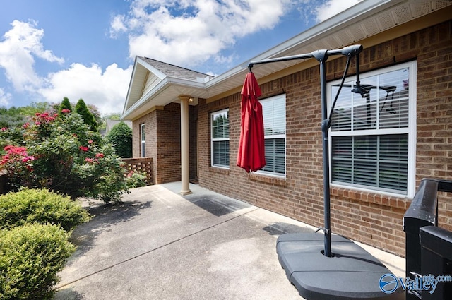 77 Valley Way Cir SE Unit 77, Huntsville, AL 35802 - view of side of property featuring brick siding and a patio area