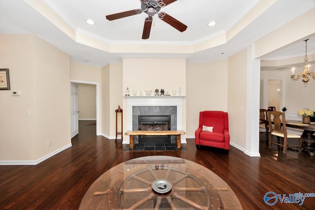 77 Valley Way Cir SE Unit 77, Huntsville, AL 35802 - living area featuring wood finished floors, a ceiling fan, a fireplace, crown molding, and a raised ceiling
