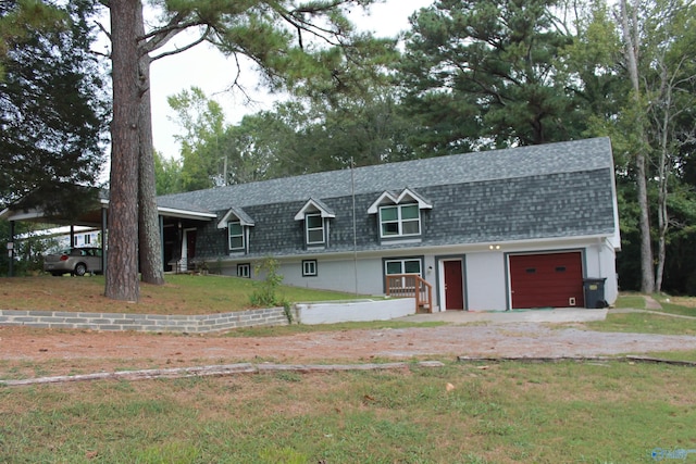 view of front facade with a garage, a carport, and a front yard